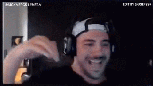 A Man Wearing Headphones And A Headband Is Smiling In A Video Chat . GIF