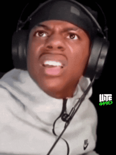 A Man Wearing Headphones And A Headband With Lite Games On The Bottom GIF