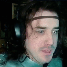 A Man Wearing Headphones And A Headband With The Letter S On It GIF