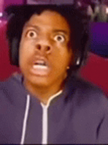 A Man Wearing Headphones And A Hoodie Is Making A Surprised Face . GIF