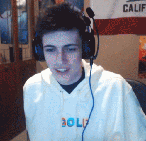 A Man Wearing Headphones And A Hoodie That Says Golf GIF