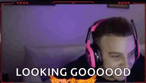 A Man Wearing Headphones And A Microphone Is Looking At The Camera And Saying `` Looking Good '' . GIF