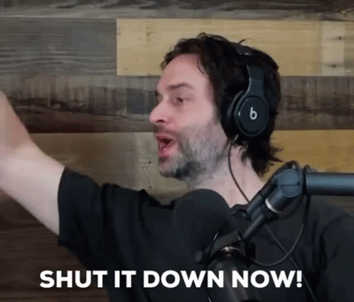 A Man Wearing Headphones And A Microphone Is Saying Shut It Down Now GIF