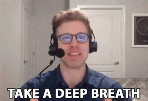 A Man Wearing Headphones And A Microphone Says Take A Deep Breath GIF