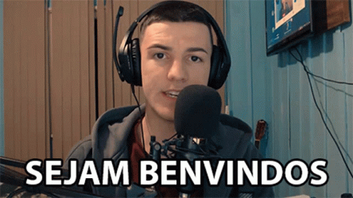 A Man Wearing Headphones And A Microphone With The Words Sejam Benvindos Below Him GIF
