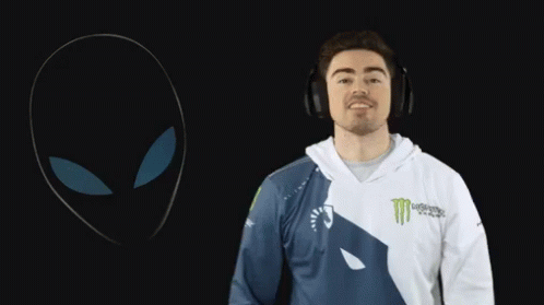A Man Wearing Headphones And A Monster Shirt GIF