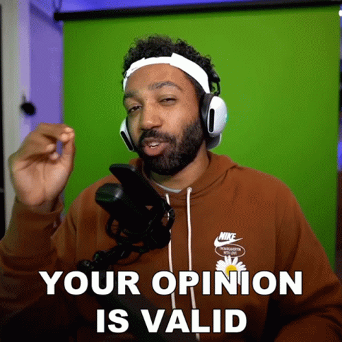 A Man Wearing Headphones And A Nike Shirt Says " Your Opinion Is Valid " GIF