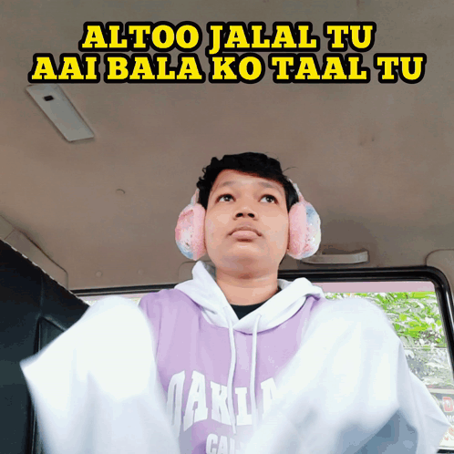 A Man Wearing Headphones And A Purple Hoodie Says Altoo Jalal Tu Aai Bala Ko Taal Tu GIF