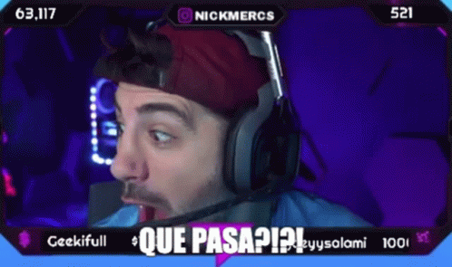 A Man Wearing Headphones And A Red Hat Says Que Pasa ? GIF