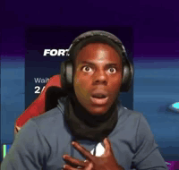 A Man Wearing Headphones And A Scarf Is Looking At The Camera With A Surprised Look On His Face . GIF