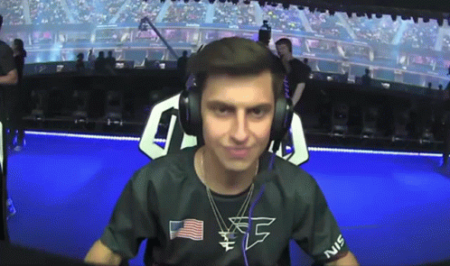 A Man Wearing Headphones And A Shirt That Says Ec On It GIF