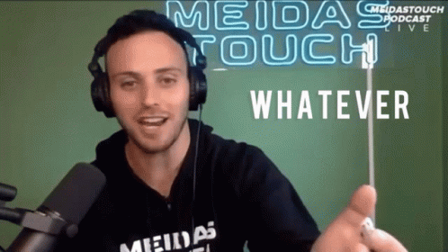 A Man Wearing Headphones And A Shirt That Says Meidas Touch GIF