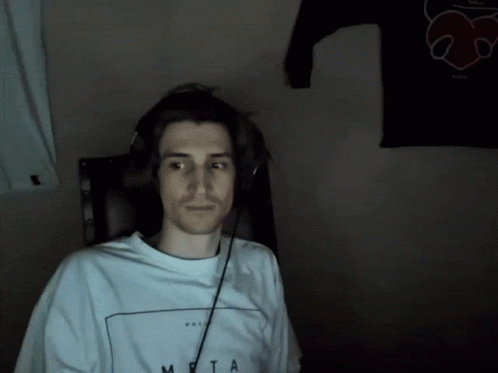A Man Wearing Headphones And A Shirt That Says Meta On It GIF