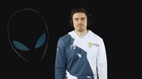 A Man Wearing Headphones And A Shirt That Says Monster On It GIF