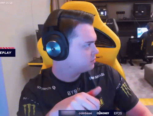 A Man Wearing Headphones And A Shirt That Says Monster On It GIF