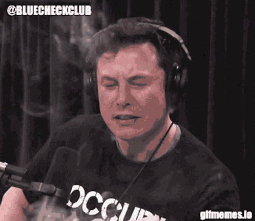 A Man Wearing Headphones And A Shirt That Says Occupied On It GIF