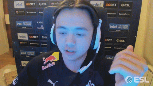 A Man Wearing Headphones And A Shirt That Says Redbull GIF