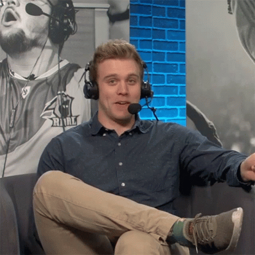 Man Wearing Headphones Sitting On Couch GIF