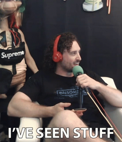 A Man Wearing Headphones And A Shirt That Says Supreme GIF