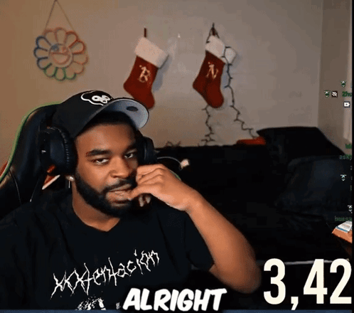 A Man Wearing Headphones And A Shirt That Says Xxxtentacion GIF