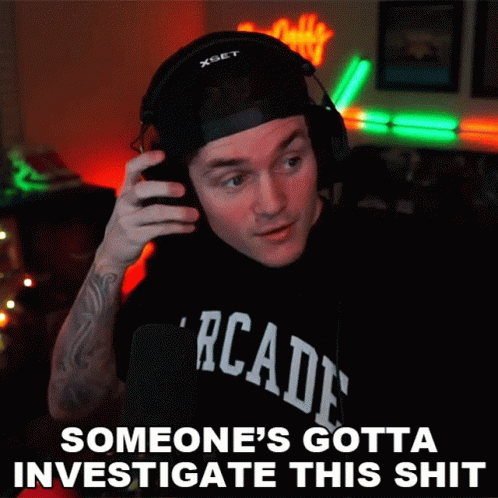 A Man Wearing Headphones And A T-Shirt That Says Arcade GIF