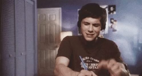 A Man Wearing Headphones And A T-Shirt That Says ' Chris ' On It GIF