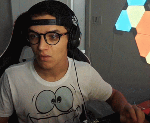 A Man Wearing Headphones And A T-Shirt With A Smiley Face On It GIF