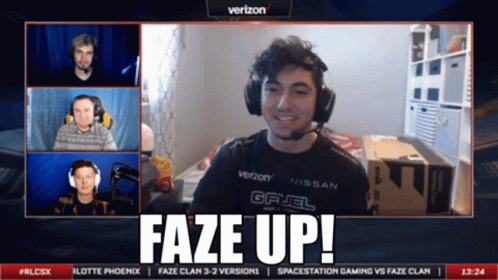 A Man Wearing Headphones And A Verizon Shirt Says Faze Up On The Screen GIF