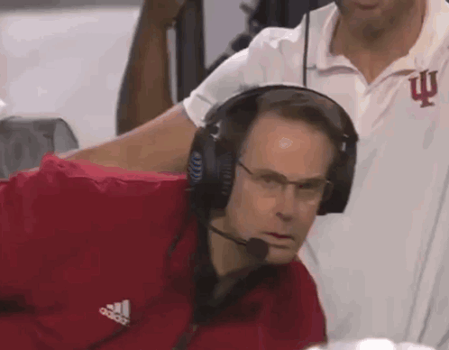 A Man Wearing Headphones And An Adidas Jacket GIF