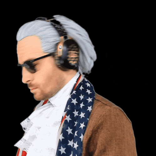 A Man Wearing Headphones And An American Flag Scarf Looks Down GIF