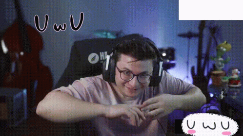 A Man Wearing Headphones And Glasses Is Sitting In A Chair With A Yamaha Logo On It GIF