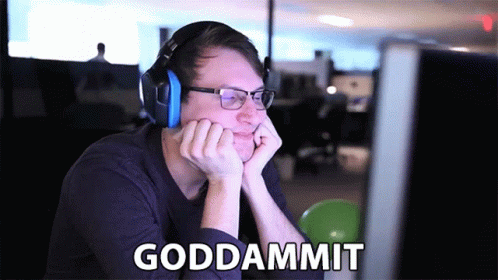 A Man Wearing Headphones And Glasses Is Sitting In Front Of A Computer With The Words Goddammit Written On The Screen GIF