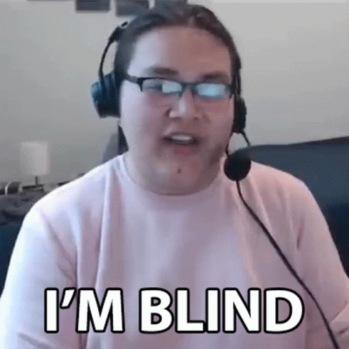 A Man Wearing Headphones And Glasses Is Talking Into A Microphone . GIF