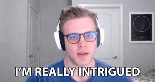 A Man Wearing Headphones And Glasses Is Talking On A Video Call . GIF
