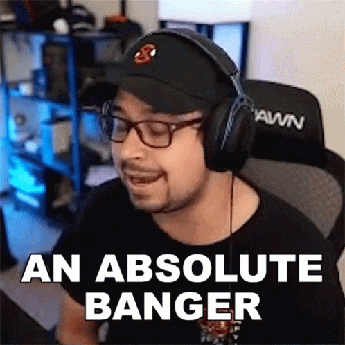 A Man Wearing Headphones And Glasses Says An Absolute Banger . GIF