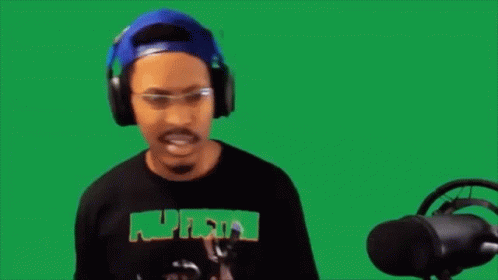 A Man Wearing Headphones And Glasses Says Fine On A Green Background . GIF