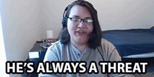 A Man Wearing Headphones And Glasses Says He 'S Always A Threat . GIF