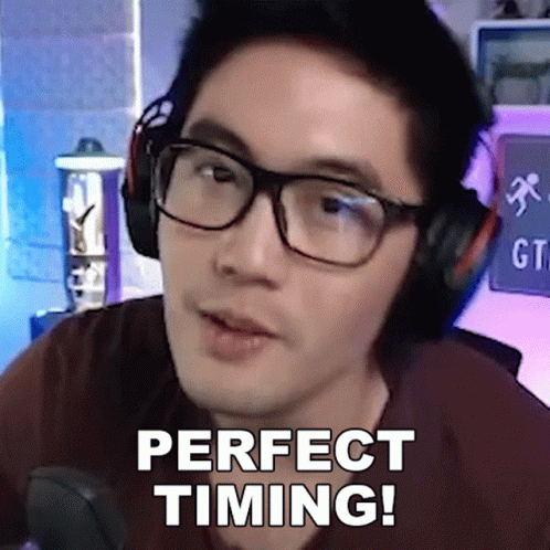 a man wearing headphones and glasses says perfect timing