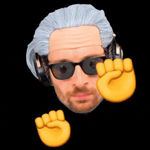 A Man Wearing Headphones And Sunglasses Has A Fist Up In The Air GIF
