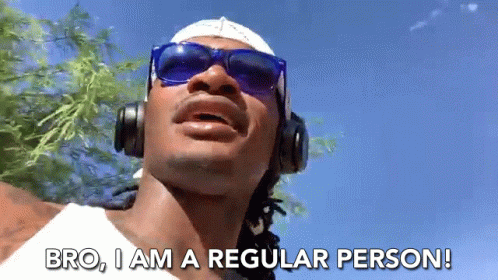 A Man Wearing Headphones And Sunglasses Is Saying Bro I Am A Regular Person GIF