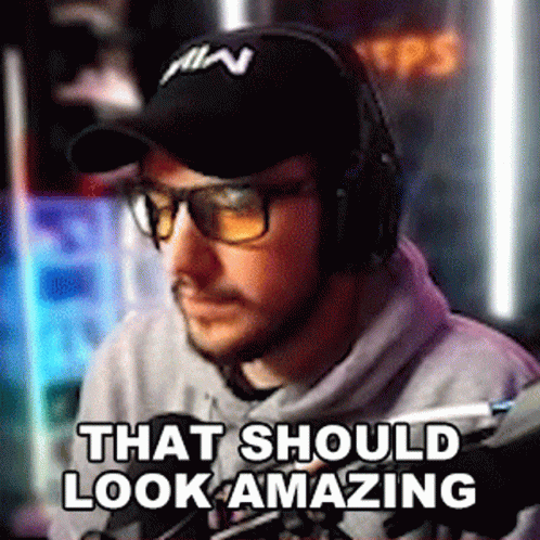 A Man Wearing Headphones And Sunglasses Is Sitting In Front Of A Microphone And Says That Should Look Amazing GIF