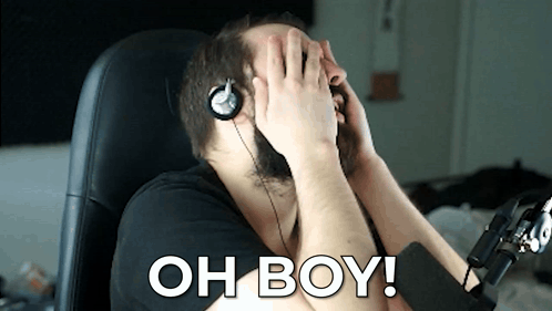 A Man Wearing Headphones Covering His Face With His Hands And The Words Oh Boy Written On The Bottom GIF