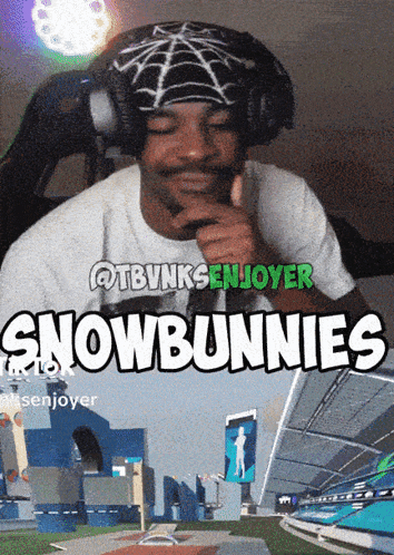 A Man Wearing Headphones Giving A Thumbs Up In Front Of A Sign That Says " Snowbunnies " GIF