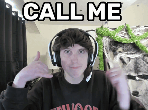 A Man Wearing Headphones Giving A Thumbs Up With The Words Call Me Behind Him GIF