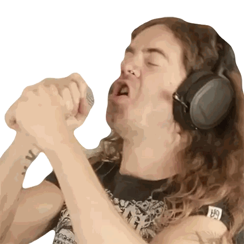 a man wearing headphones has a tattoo on his arm that says ' gk '