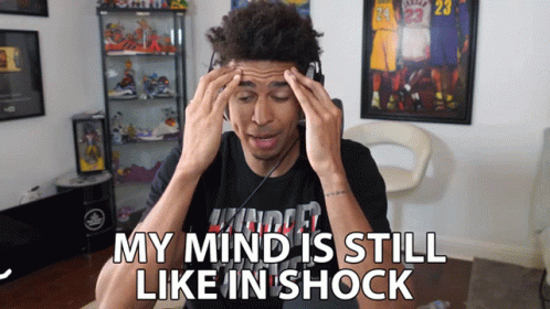 A Man Wearing Headphones Has His Hands On His Head And The Words My Mind Is Still Like In Shock GIF