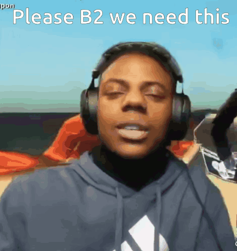 A Man Wearing Headphones Is Asking For B2 GIF