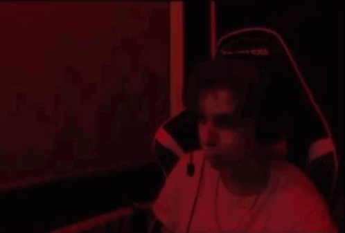 Man Dancing With Headphones In Red Light GIF