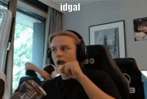 A Man Wearing Headphones Is Eating Chips While Sitting In A Chair In Front Of A Window . GIF