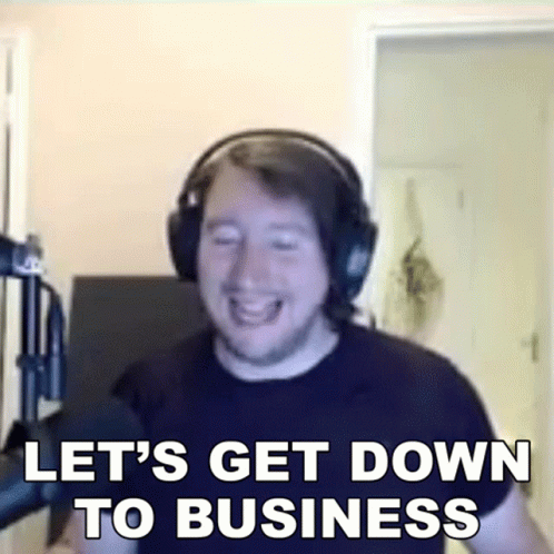 A Man Wearing Headphones Is Laughing And Saying Let 'S Get Down To Business GIF
